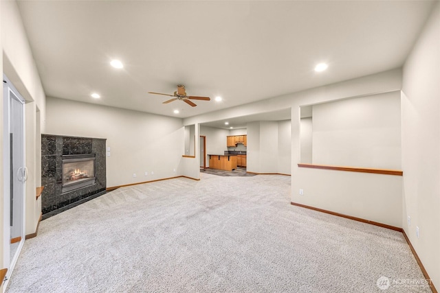 8 Southern Ct, Bellingham, WA 98229 - unfurnished living room featuring recessed lighting, light carpet, a tile fireplace, and a ceiling fan