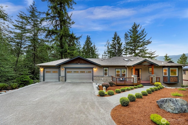 8 Southern Ct, Bellingham, WA 98229 - view of front of home with concrete driveway, an attached garage, and stone siding