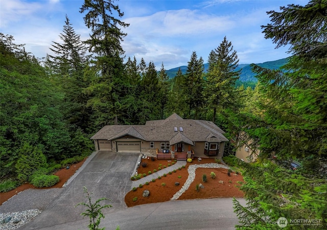 8 Southern Ct, Bellingham, WA 98229 - view of front of home featuring driveway, a garage, a view of trees, and a mountain view