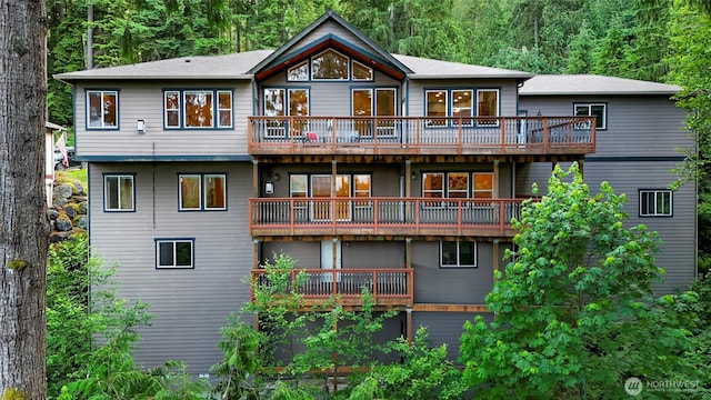 8 Southern Ct, Bellingham, WA 98229 - back of house with a balcony and a wooded view