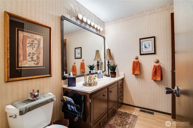 3500 SW 325th St, Federal Way, WA 98023 - bathroom with wallpapered walls, wood finished floors, and vanity