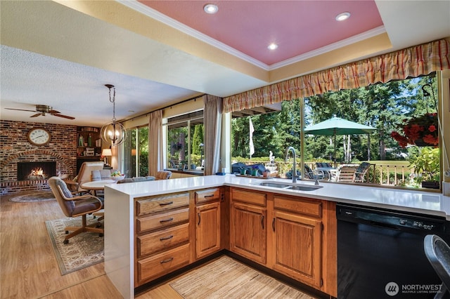 3500 SW 325th St, Federal Way, WA 98023 - kitchen featuring black dishwasher, light countertops, a fireplace, open floor plan, and crown molding