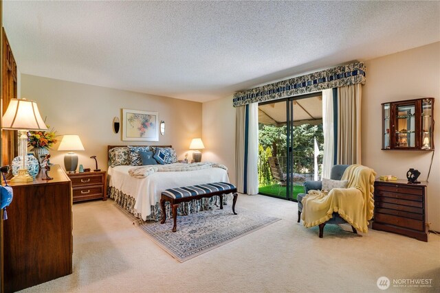3500 SW 325th St, Federal Way, WA 98023 - bedroom with light colored carpet, access to outside, and a textured ceiling