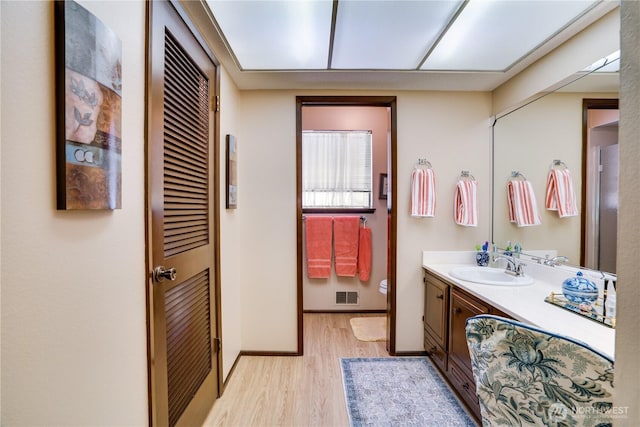 3500 SW 325th St, Federal Way, WA 98023 - bathroom with wood finished floors, vanity, and a closet