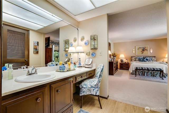 3500 SW 325th St, Federal Way, WA 98023 - bathroom featuring vanity, ensuite bathroom, and wood finished floors