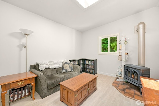 6070 Saxon Rd, Acme, WA 98220 - living room with a wood stove and light wood-style flooring
