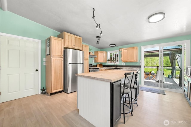 6070 Saxon Rd, Acme, WA 98220 - kitchen with appliances with stainless steel finishes, light brown cabinetry, wooden counters, and light wood-style floors