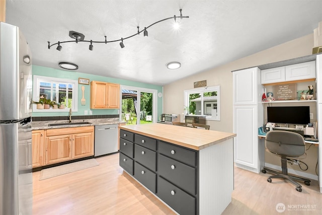 6070 Saxon Rd, Acme, WA 98220 - kitchen featuring appliances with stainless steel finishes, butcher block countertops, light wood-style floors, an office area, and a center island