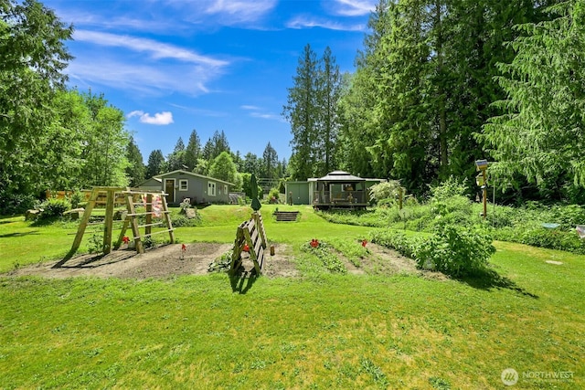 6070 Saxon Rd, Acme, WA 98220 - view of green lawn with view of scattered trees and a deck