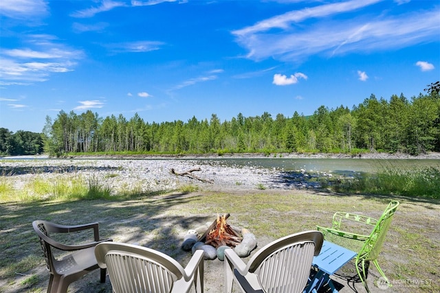 6070 Saxon Rd, Acme, WA 98220 - view of yard featuring a fire pit, a wooded view, and a water view