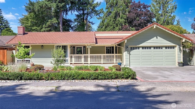 16621 148th Ave SE, Renton, WA 98058 - ranch-style home with a tiled roof, an attached garage, a chimney, and covered porch