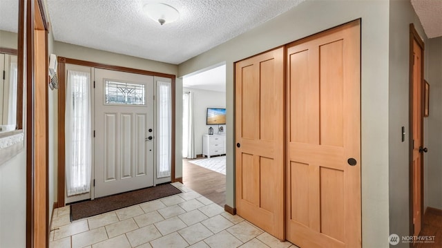 16621 148th Ave SE, Renton, WA 98058 - entrance foyer featuring a textured ceiling and light tile patterned floors