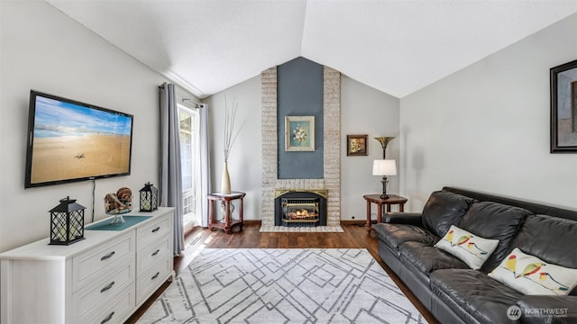 16621 148th Ave SE, Renton, WA 98058 - living area with dark wood-type flooring, lofted ceiling, and a fireplace