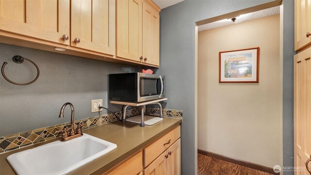 16621 148th Ave SE, Renton, WA 98058 - washroom with a sink and dark wood-style flooring