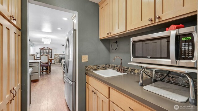 16621 148th Ave SE, Renton, WA 98058 - washroom featuring light wood-style flooring and recessed lighting