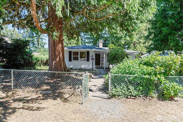 1528 NE 166th St, Shoreline, WA 98155 - view of front of house with a chimney and a fenced front yard