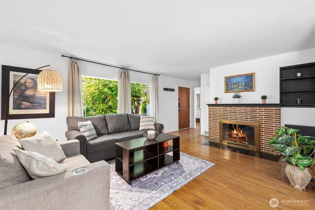 1528 NE 166th St, Shoreline, WA 98155 - living room with wood finished floors and a brick fireplace