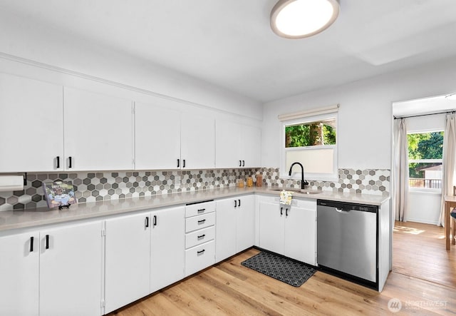 1528 NE 166th St, Shoreline, WA 98155 - kitchen featuring dishwasher, light countertops, decorative backsplash, white cabinetry, and light wood-type flooring