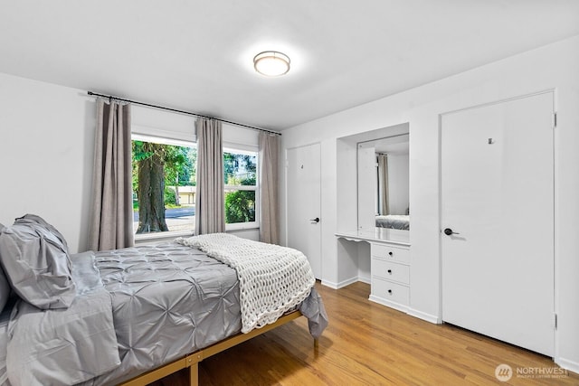 1528 NE 166th St, Shoreline, WA 98155 - bedroom featuring light wood-style flooring and baseboards