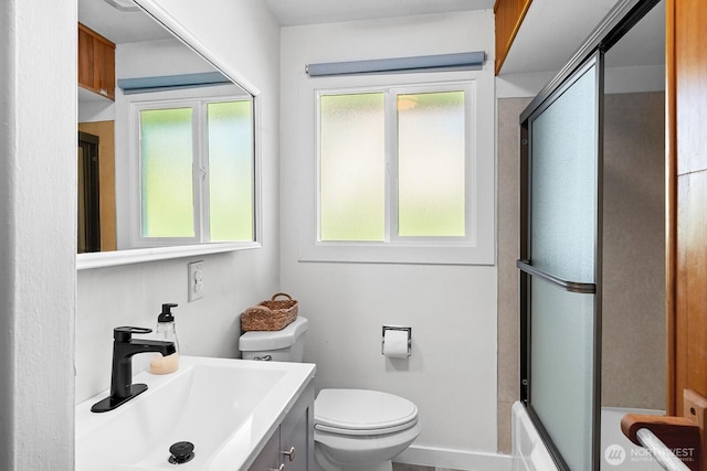 1528 NE 166th St, Shoreline, WA 98155 - bathroom with healthy amount of natural light, vanity, and shower / bath combination with glass door
