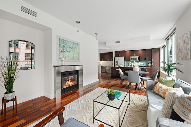 910 Lenora St Unit S403, Seattle, WA 98121 - living area with wood finished floors and a glass covered fireplace