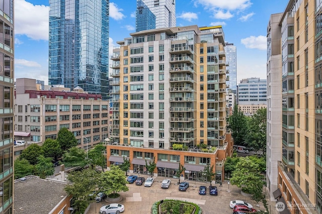 910 Lenora St Unit S403, Seattle, WA 98121 - view of building exterior featuring uncovered parking and a city view