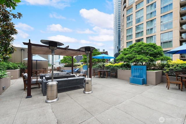 910 Lenora St Unit S403, Seattle, WA 98121 - view of patio featuring outdoor dining space and a pergola