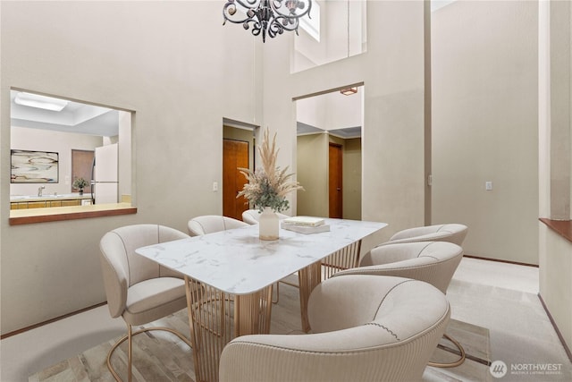2514 174th Ave NE, Redmond, WA 98052 - carpeted dining area featuring a chandelier and a high ceiling