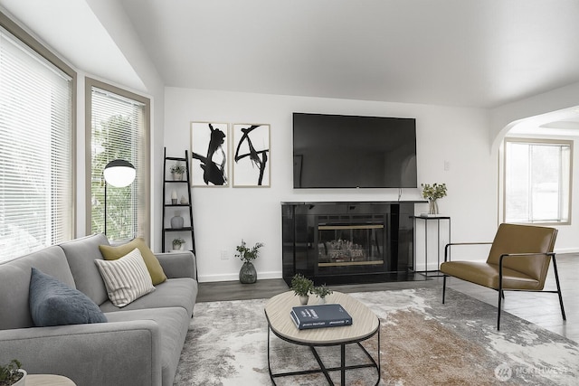 34801 30th Ave SW, Federal Way, WA 98023 - living area with wood finished floors, arched walkways, and a glass covered fireplace