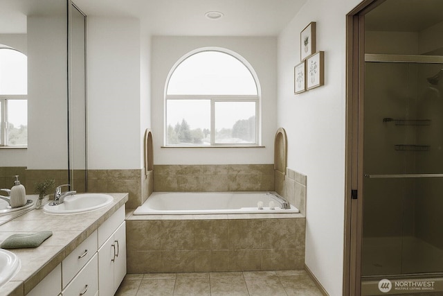 34801 30th Ave SW, Federal Way, WA 98023 - bathroom featuring double vanity, a garden tub, a shower stall, and tile patterned flooring