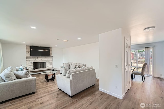 721 S 304th St, Federal Way, WA 98003 - living area with light wood-style floors, a stone fireplace, and recessed lighting