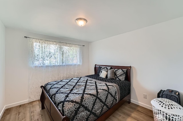 721 S 304th St, Federal Way, WA 98003 - bedroom with wood finished floors and baseboards