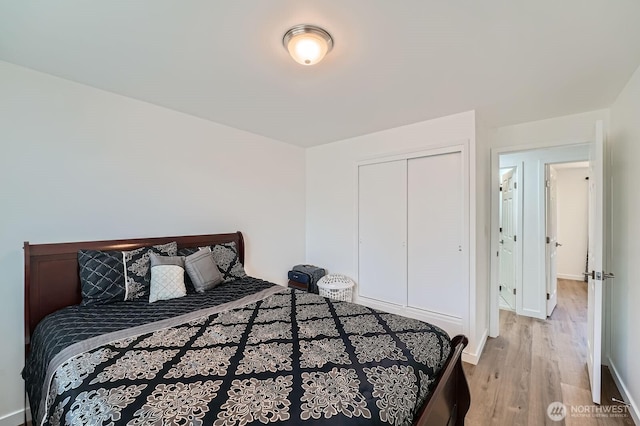721 S 304th St, Federal Way, WA 98003 - bedroom with light wood finished floors and a closet