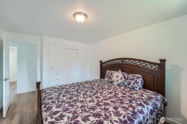721 S 304th St, Federal Way, WA 98003 - bedroom with light wood finished floors and a closet