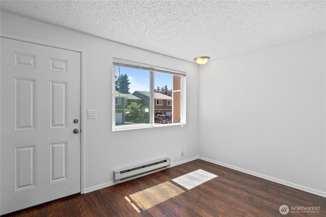 24814 SE 145th Ln, Kent, WA 98042 - entryway with a baseboard heating unit, wood finished floors, and a textured ceiling
