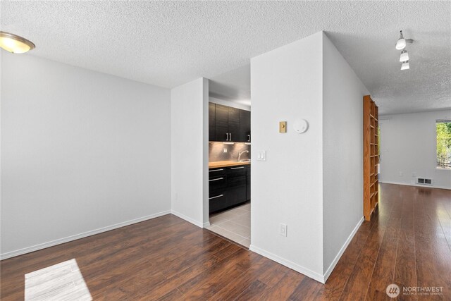 24814 SE 145th Ln, Kent, WA 98042 - empty room featuring a textured ceiling and wood finished floors