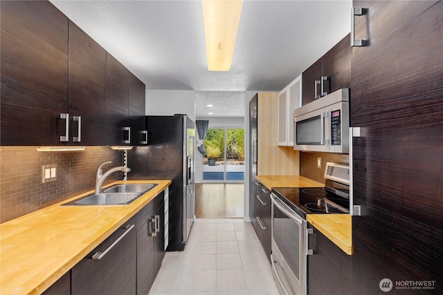 24814 SE 145th Ln, Kent, WA 98042 - kitchen with appliances with stainless steel finishes, wooden counters, and modern cabinets