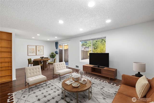 24814 SE 145th Ln, Kent, WA 98042 - living room featuring wood finished floors, a textured ceiling, and recessed lighting