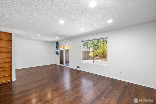 24814 SE 145th Ln, Kent, WA 98042 - spare room with a textured ceiling, recessed lighting, and wood finished floors