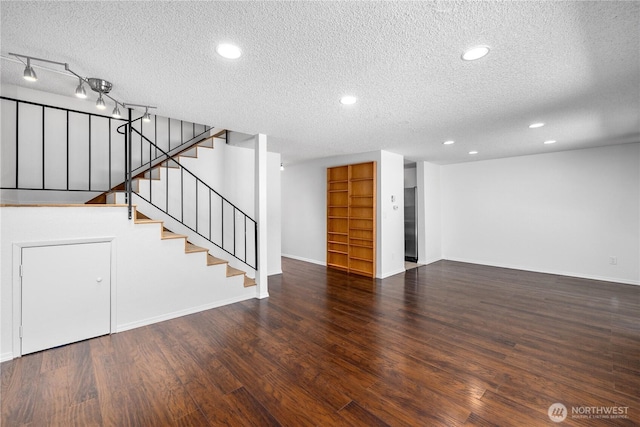 24814 SE 145th Ln, Kent, WA 98042 - unfurnished living room featuring a textured ceiling, wood finished floors, stairs, and recessed lighting