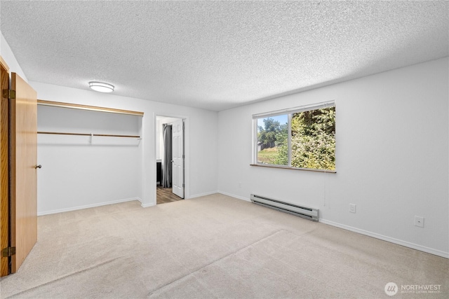 24814 SE 145th Ln, Kent, WA 98042 - unfurnished bedroom featuring a baseboard radiator, a textured ceiling, carpet floors, and a closet