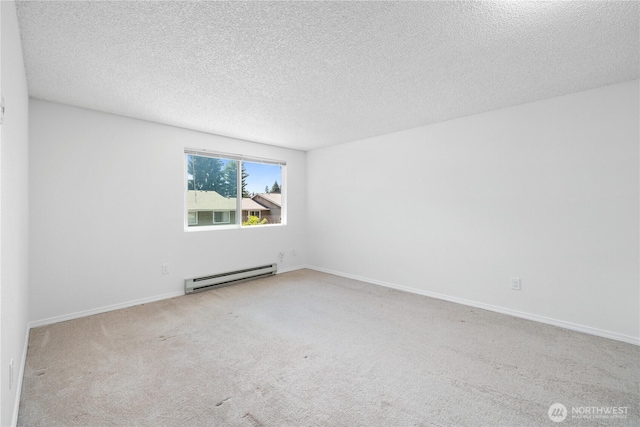 24814 SE 145th Ln, Kent, WA 98042 - carpeted empty room with a baseboard radiator and a textured ceiling