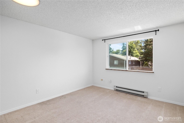 24814 SE 145th Ln, Kent, WA 98042 - spare room featuring a baseboard radiator, a textured ceiling, and carpet flooring