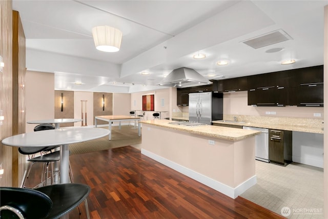 2911 2nd Ave Unit 1117, Seattle, WA 98121 - kitchen with stainless steel appliances, modern cabinets, light wood-type flooring, and a center island