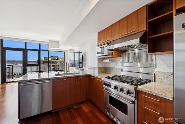 2911 2nd Ave Unit 1117, Seattle, WA 98121 - kitchen featuring appliances with stainless steel finishes, ventilation hood, a peninsula, dark wood finished floors, and open shelves