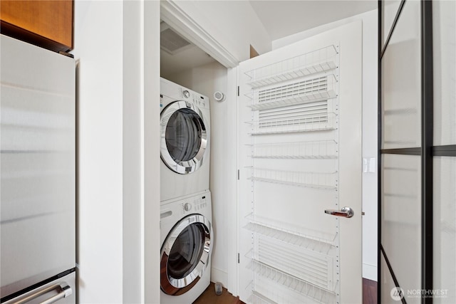 2911 2nd Ave Unit 1117, Seattle, WA 98121 - laundry area featuring estacked washer and dryer