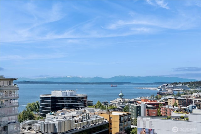 2911 2nd Ave Unit 1117, Seattle, WA 98121 - water view featuring a mountainous background and nearby urban area