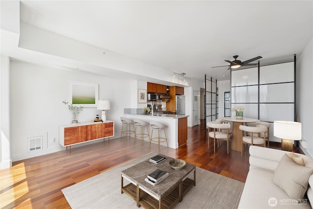 2911 2nd Ave Unit 1117, Seattle, WA 98121 - living area featuring wood finished floors and a ceiling fan