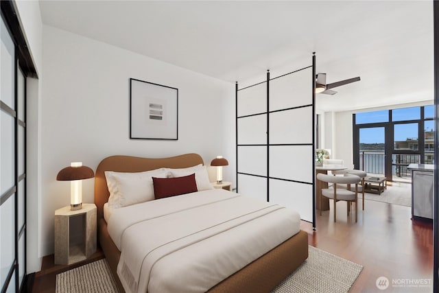 2911 2nd Ave Unit 1117, Seattle, WA 98121 - bedroom featuring wood finished floors