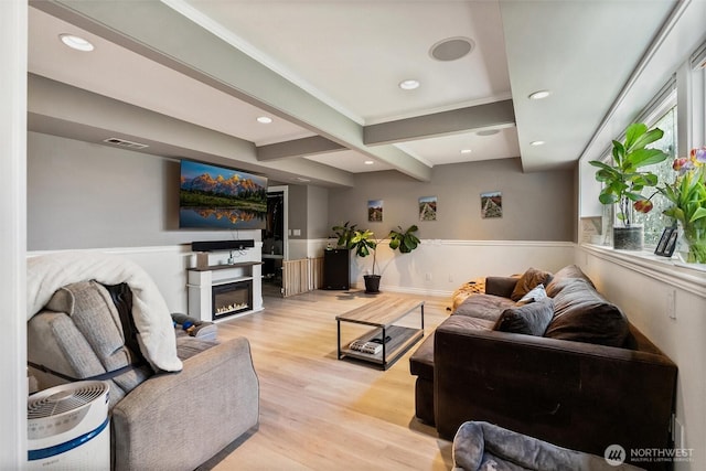 22616 88th Ave W, Edmonds, WA 98026 - living area featuring light wood-type flooring, beamed ceiling, a glass covered fireplace, and recessed lighting
